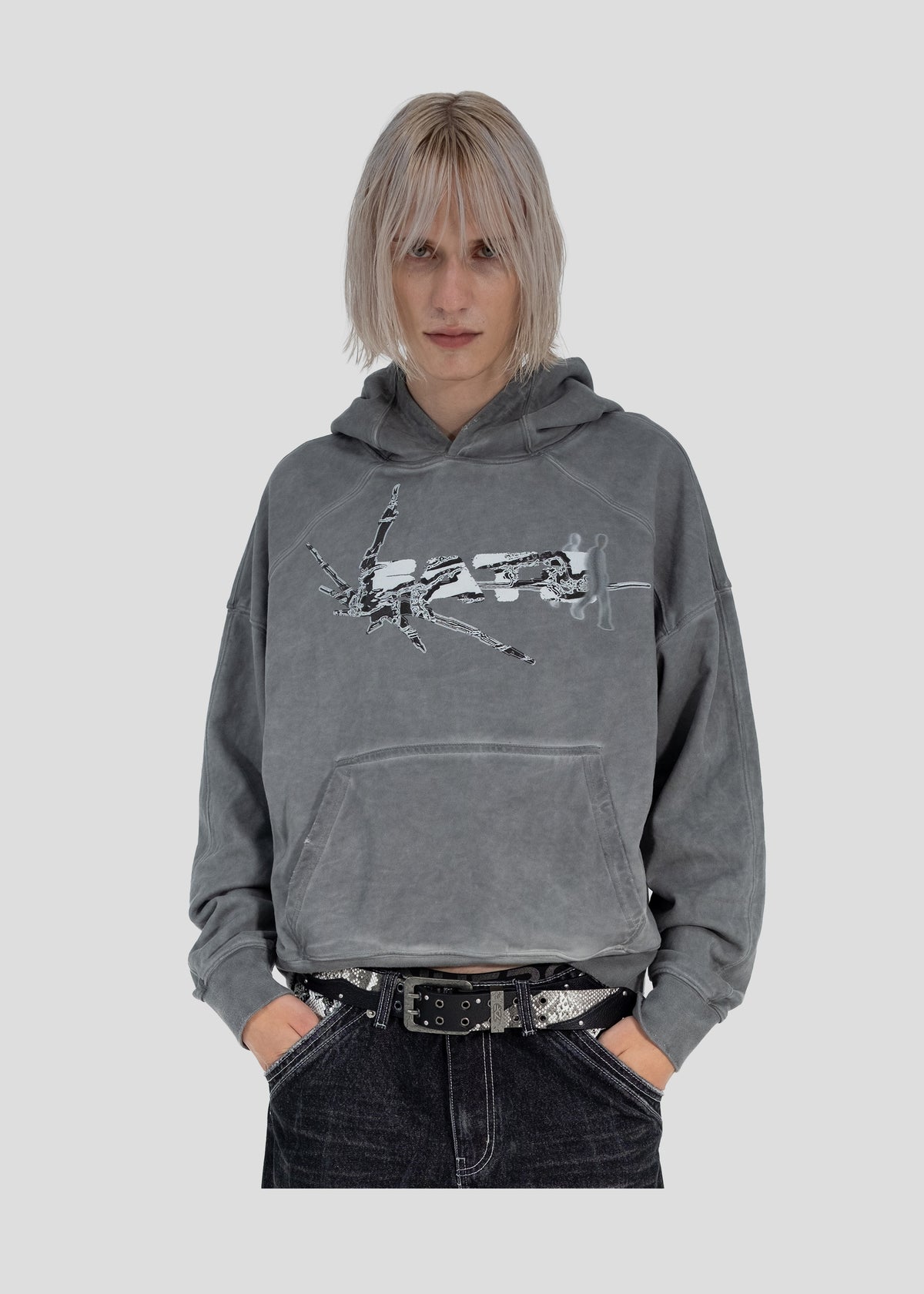 Model wearing the ONEFATE Dyed Hoodie with hands in the pockets, front view