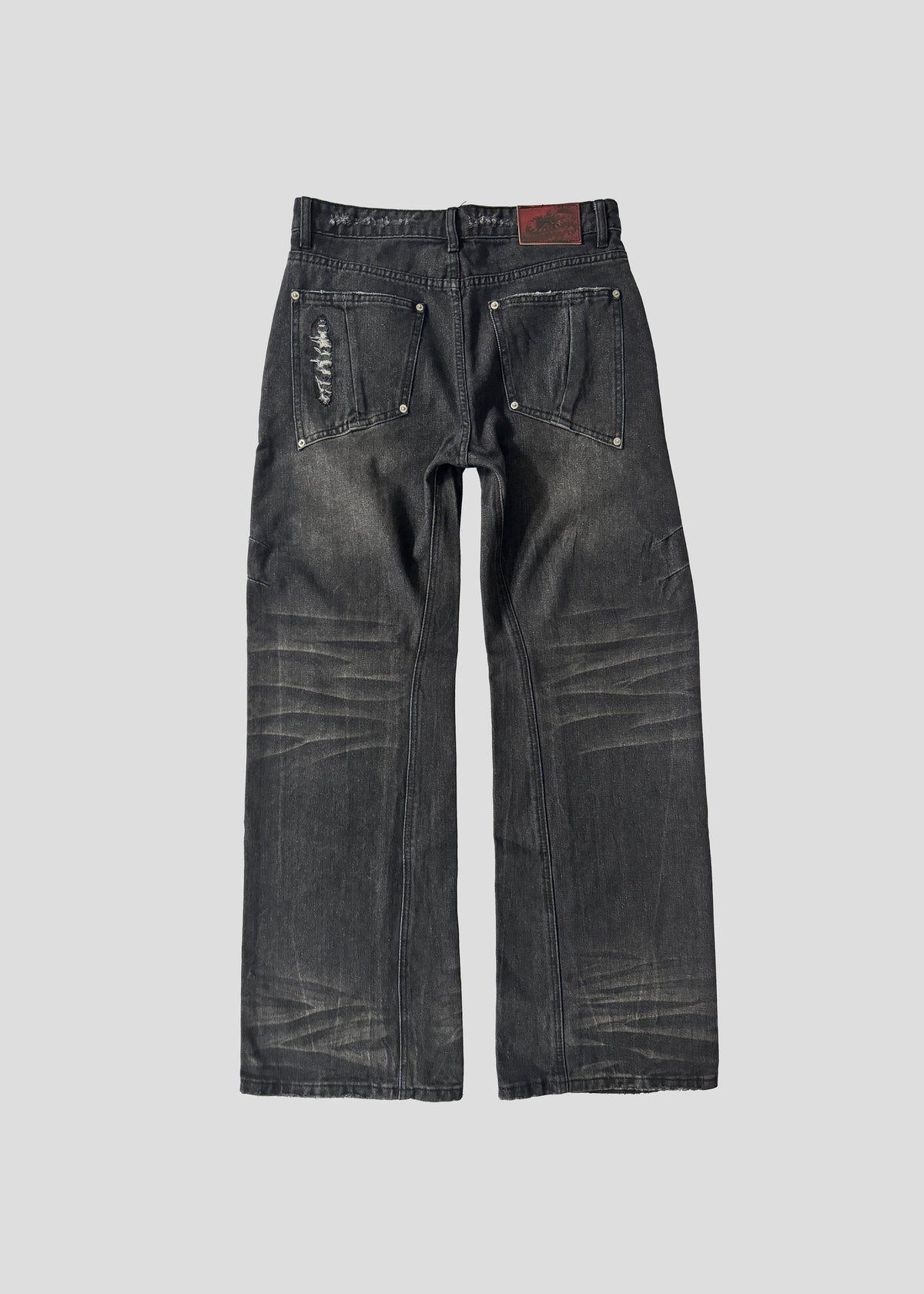 ONEFATE Snake Jeans, back view, with studded back pockets and the embossed ONEFATE logo patch at the waistband
