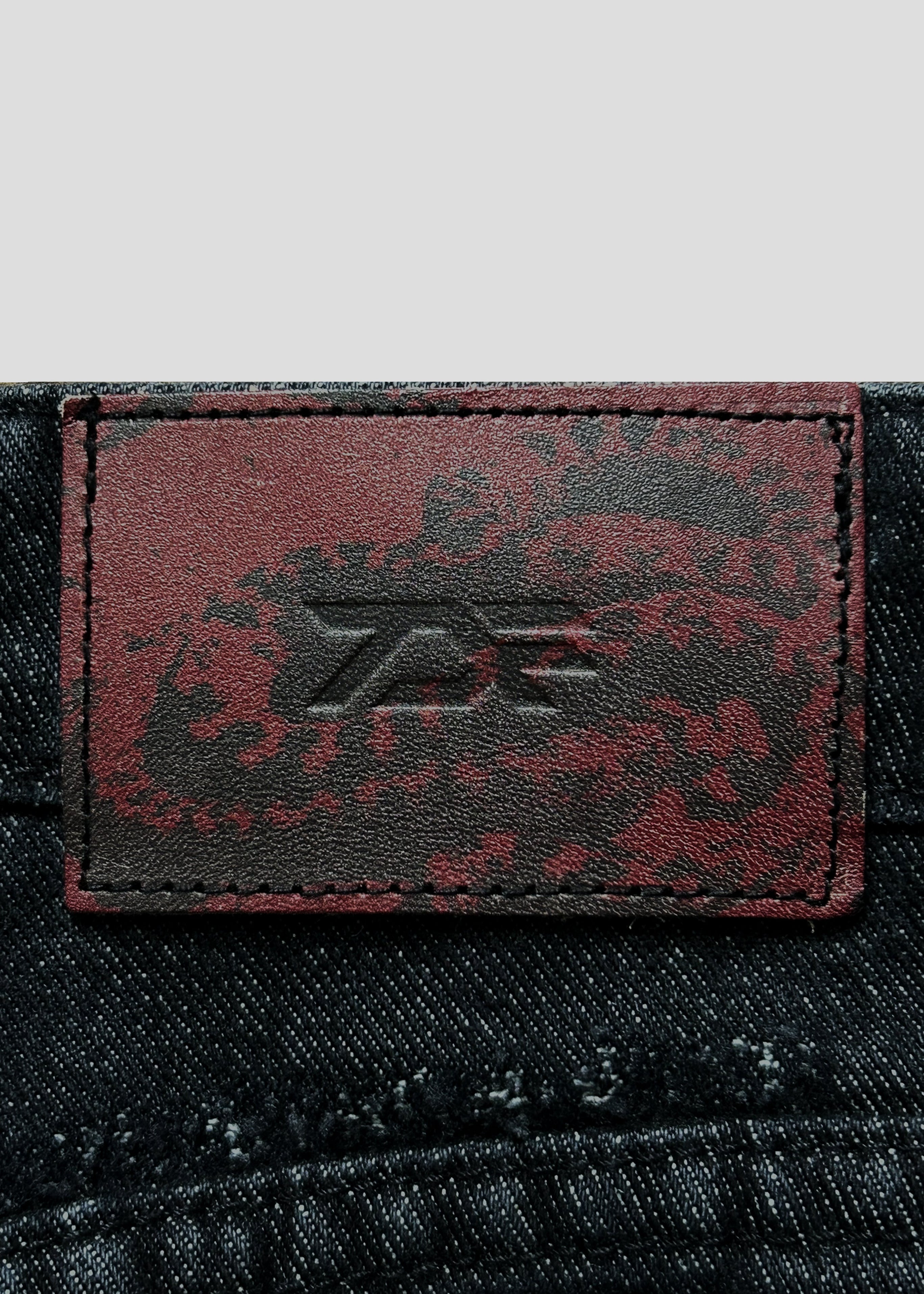 RISEBEYOND SNAKE JEANS